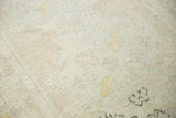 Distressed hand-knotted pile of Oushak runner, showcasing muted ivory, saffron, and peach.