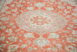 Distressed hand knotted Oushak rug with ornate grey medallion and faded cranberry field.