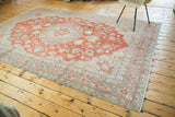 Distressed Oushak carpet, softened cranberry red field with muted grey traditional patterns.