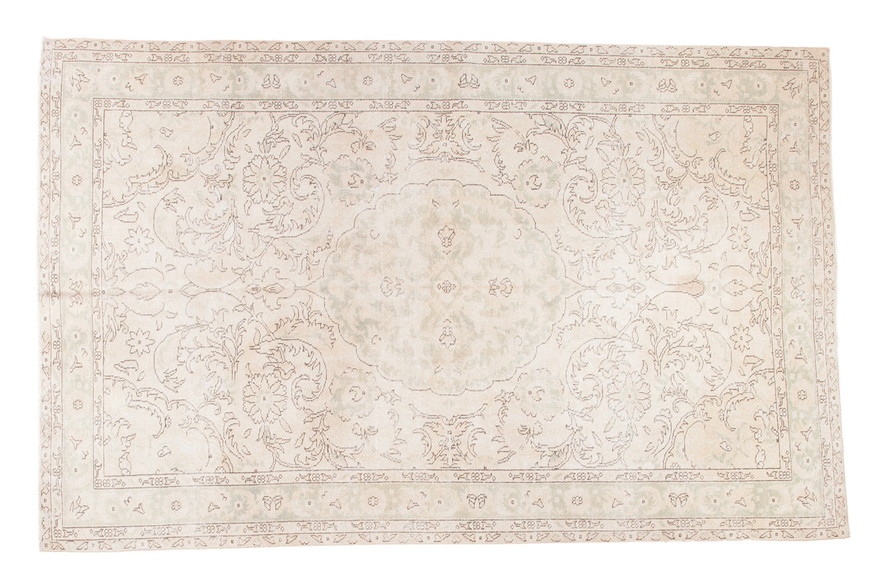Distressed Oushak carpet, faded ivory, beige, and time-softened green medallion, 6'3