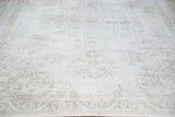 Vintage Oushak carpet with delicate beige, ivory, and pastel floral design detail.