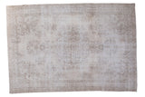 Vintage Oushak carpet with faded central medallion and allover botanical design in beige and charcoal.