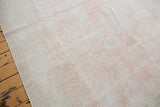 Distressed blush rose, ivory, light grey Oushak pile with subtle design.