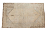 Vintage distressed Oushak carpet with subtle medallion and soft earth tones, 6'1
