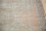 Distressed Oushak rug runner pile, showing soft beige and apricot peach texture.