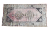 Distressed abstract Oushak rug, blush rose field, geometric double medallions, charcoal.