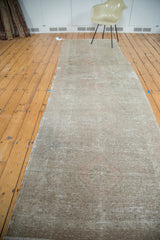 Textured pile of the distressed Oushak runner, revealing subtle beige and blush geometric patterns.