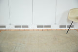 Textured distressed Oushak rug surface with subtle silver, grey, and white tones.