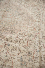 Intricate distressed Oushak rug pattern in faded antique ivory, blush, and light blue.