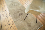 Distressed Oushak runner with triple geometric medallions in beige gold and charcoal.