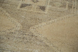 Distressed hand-knotted Oushak rug runner pile with muted beige gold and charcoal.
