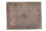 Distressed Oushak carpet, faded quatrefoil medallion, cloudband motifs, silver, grey, green.