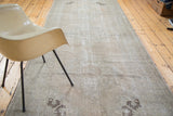 Distressed Turkish Oushak runner with faded analogous tones and soft texture.
