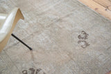 Distressed Oushak runner with exposed foundation, showing textural faded grey and charcoal patterns.