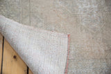 Distressed Oushak rug pile with exposed foundation, revealing its authentic texture.