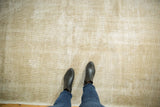 Worn texture and subtle muted design of this distressed ivory and beige Oushak rug.