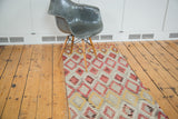 1980s vintage Turkish Kilim runner with geometric diamond lattice in red, saffron, and ivory.