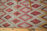 Hand woven Turkish Kilim runner detail: geometric diamond lattice in cinnabar red, pewter, ivory.