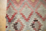 Hand woven Turkish Kilim with geometric diamond pattern in saffron, blush, cinnabar, grey.