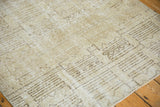 Distressed Oushak rug's ivory and charcoal abstract geometric pattern.