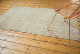 Modern distressed Oushak rug, abstract ivory and subtle sage geometric patterns.