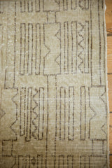 Distressed abstract Oushak rug texture with geometric lines in ivory, soft sage, and charcoal.