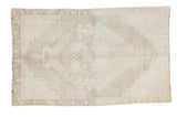 Distressed hand-knotted Turkish Oushak rug with tribal geometric medallion on a silver field, 3'1