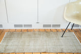 Textured silver and white distressed Oushak rug, showing its neutral palette and full form.