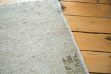 Distressed pile texture of vintage Oushak rug, with platinum, silver, and charcoal tones.