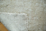 Oushak rug hand-knotted foundation, distressed silver pile, and visible fringe.
