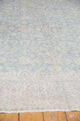 Distressed Oushak carpet, time-softened slate blue grey and ivory floral palmettes with aged pile.