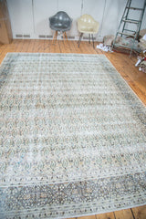 Distressed texture and faded beige border on a vintage Khorassan carpet with subtle paisley.