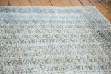 Textured allover paisley design in faded apricot, beige, and light blue on the vintage Khorassan carpet.