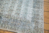Distressed border detail revealing faded peach, beige, and blue tones of the Khorassan carpet.