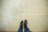 Distressed Oushak rug, showing faded ivory, silver, and light beige tones in the worn pile.