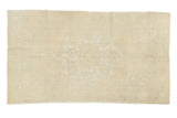 Distressed hand-knotted Oushak rug featuring a faded scalloped medallion on ivory, 4'6