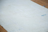 Hand-knotted foundation on the reverse of a vintage Oushak rug, with faint blue threads.