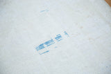 Hand-knotted foundation of a distressed Oushak rug, with tight off-white weave and faint blue.