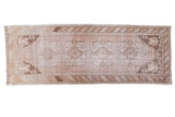 Distressed Oushak runner with faded rose medallion field and ivory, beige tones, 3'3