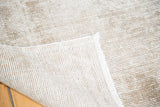 Hand-knotted foundation and light ivory fringe of the distressed Oushak runner.
