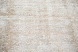 Distressed Oushak runner with low pile, textured in soft beige, apricot, and platinum.