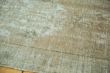 Distressed vintage Oushak rug detail: exposed foundation and muted, textured low pile.