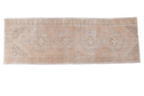 Distressed Oushak runner with faded curvilinear medallions on a light apricot field, 3'1