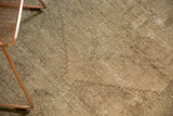 Distressed texture of a vintage hand knotted Oushak rug with muted pale grey tones.
