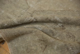 Faded pale grey distressed Oushak rug texture with visible hand knotted weave.