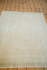 Distressed Oushak rug pile with subtle beige, platinum, and faded aqua blue tones.
