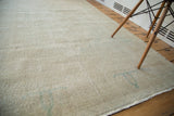 Distressed vintage Oushak rug pile featuring faded aqua blue and light beige tones.