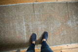 Long distressed Oushak runner with soft apricot, grey, and light wood color palette.