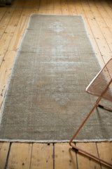 Distressed texture and fringe on a vintage hand knotted Turkish Oushak runner.