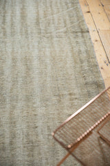 Distressed vintage Oushak rug, showing finely shorn pile texture and weaver lines.